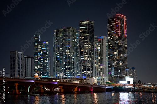 Night photo highrise condos Downtown Miami with bridge and bay © Felix Mizioznikov