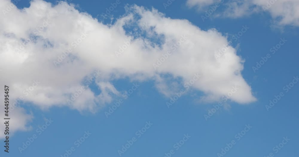 Summer blue sky time lapse. Nature weather blue sky. White clouds background. Cloud time lapse nature background. Blue sky white clouds. Puffy fluffy white clouds. Cumulus cloud cloudscape time-lapse Summer blue sky time lapse. Nature weather blue sky. White clouds background. Cloud time lapse nature background. Blue sky white clouds. Puffy fluffy white clouds. Cumulus cloud cloudscape time-lapse