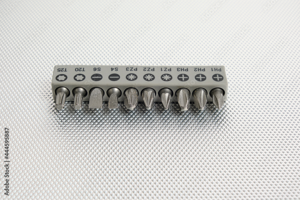 Set of attachments, bits for a screwdriver on a white background. Set of attachments, bits for a screwdriver on a white background.