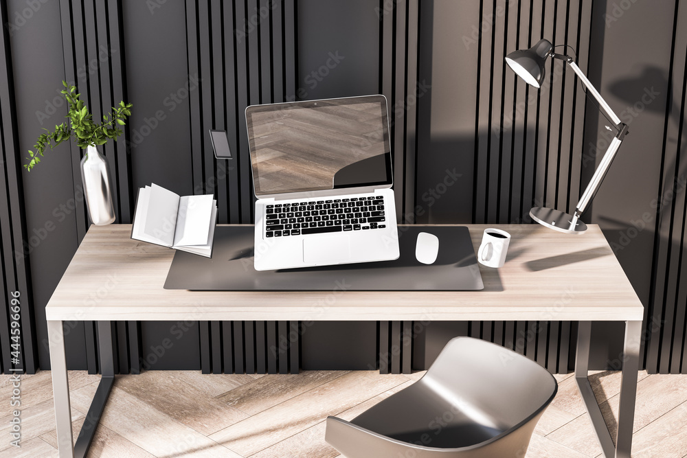 Fototapeta premium Hipster office interior with empty black laptop screen and other objects flying above desktop. Mock up, 3D Rendering.