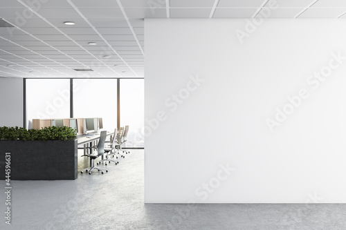 Modern concrete coworking office interior with furniture, window with city view, daylight and empty mockup place on wall. Corporate concept. Mock up, 3D Rendering.