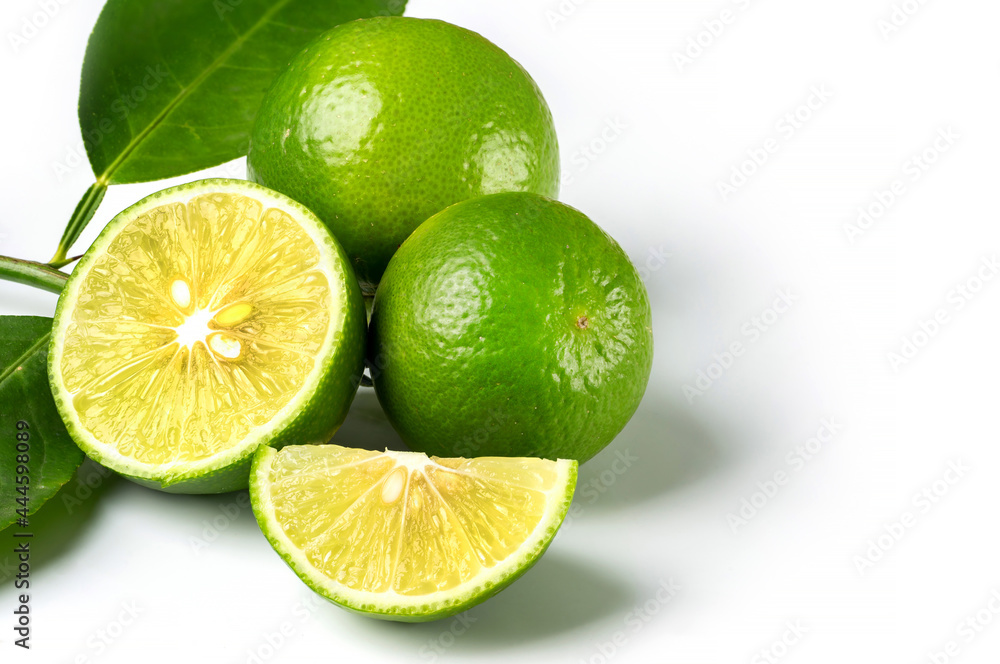 Close up natural fresh lime with sliced, green leaf isolated on white background. Close up natural fresh lime with sliced, green leaf isolated on white background.