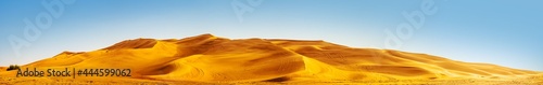 Golden Sand Dune Desert Landscape Panaroma. Beautiful sunset over the sand dunes in the Al Madam Desert  Sharjah  UAE.