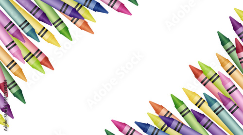 A colorful pile of crayons in the corners on a white background
