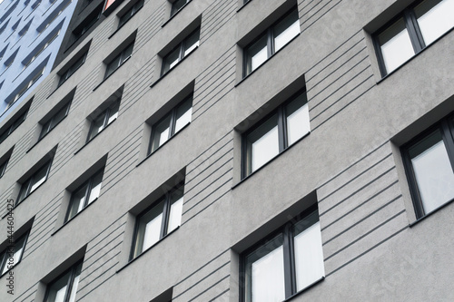 Fragment facade of a modern office building with glazing, perspective. 