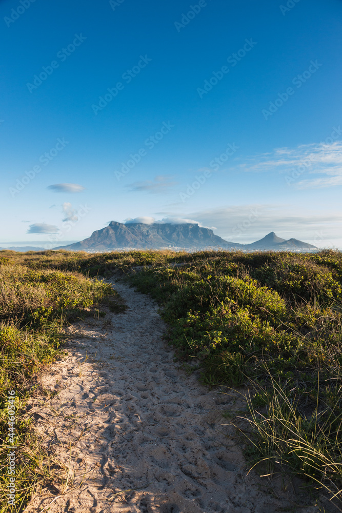 Fototapeta premium Sand Trail leading to Table Mountain and Signal Hill viewed from Sunset Beach - Cape Town - Western Cape - South Africa