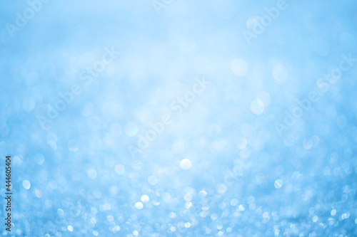 Light blue abstract bokeh background in a white luminous haze