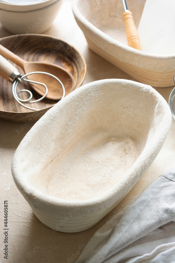 Rattan banneton, proofing basket for sourdough bread. Baking utensile. Basic set of baking bread at home. Rattan banneton, proofing basket for sourdough bread. Baking utensile. Basic set of baking bread at home.