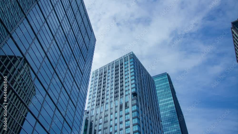 A timelapse of clowd at the building in the business town wide shot tilt A timelapse of clowd at the building in the business town wide shot tilt