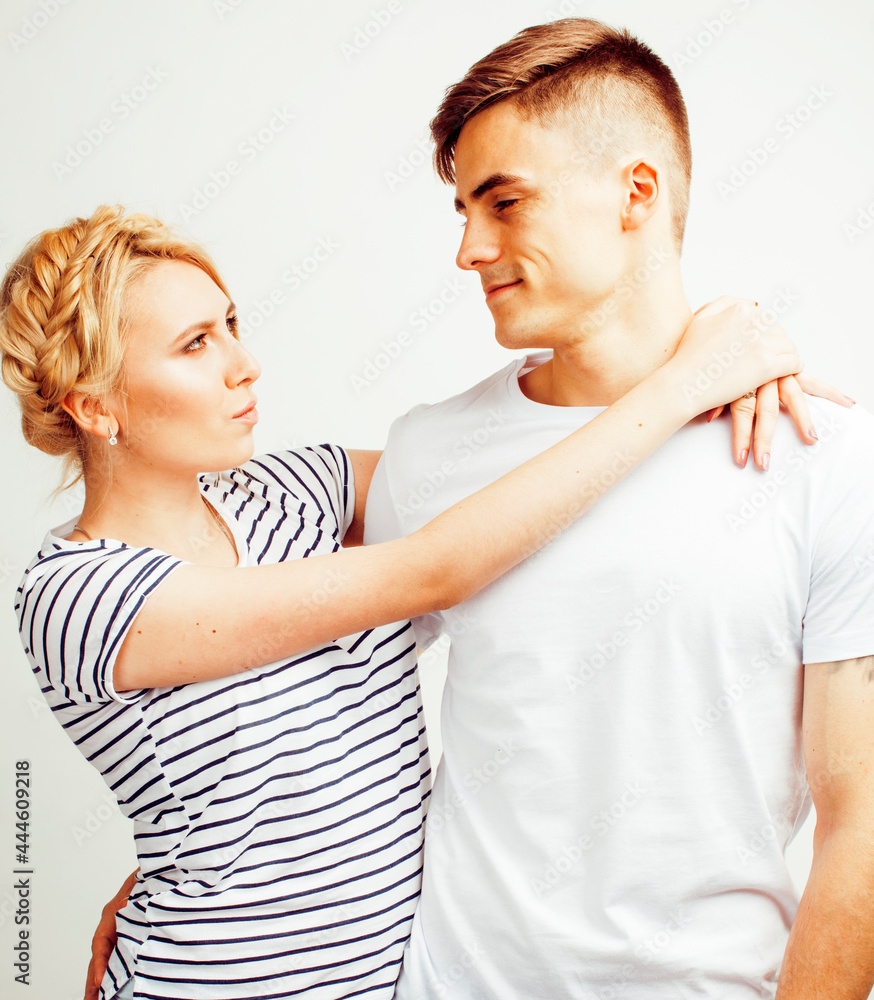 young pretty teenage couple, hipster guy with his girlfriend happy smiling and hugging isolated on white background, lifestyle people concept young pretty teenage couple, hipster guy with his girlfriend happy smiling and hugging isolated on white background, lifestyle people concept