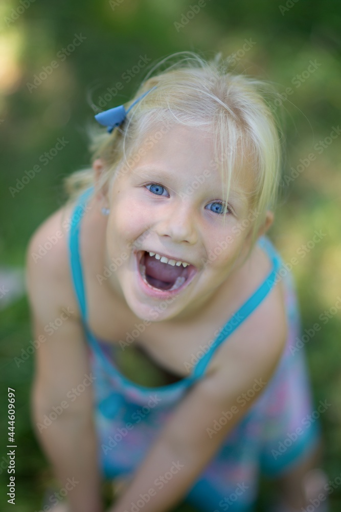 Summer portrait of a little girl in nature. Summer portrait of a little girl in nature.