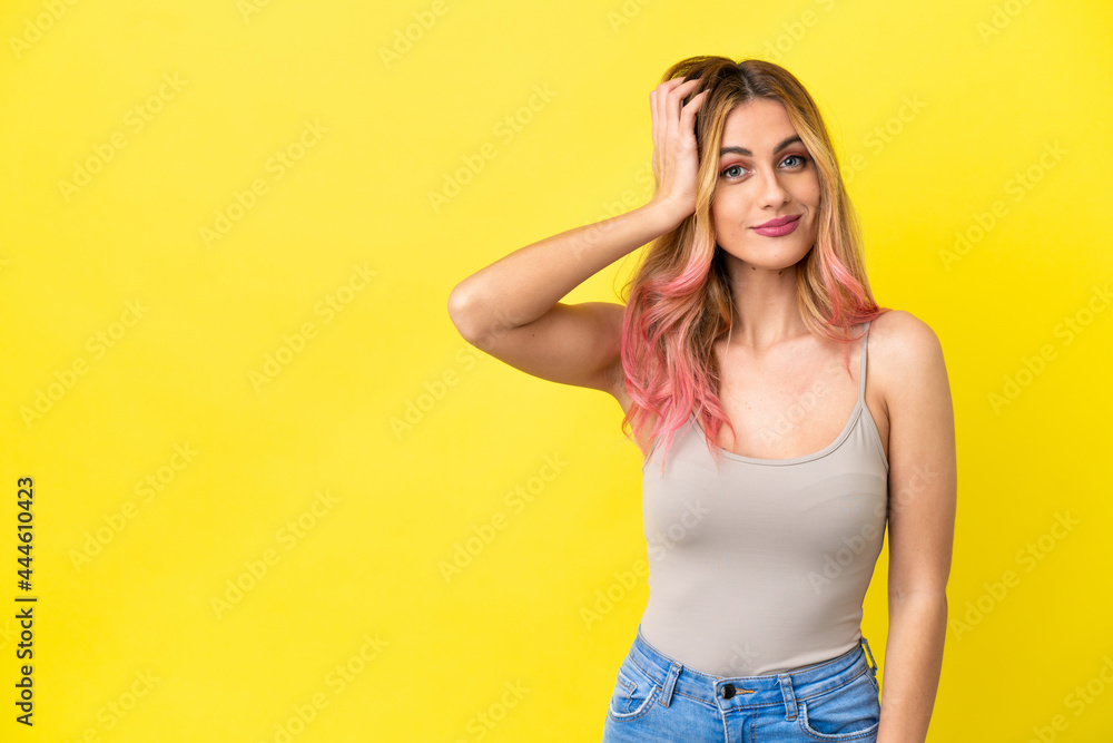 Young woman over isolated yellow background with an expression of frustration and not understanding Young woman over isolated yellow background with an expression of frustration and not understanding