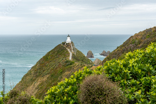 Famous landscape and lighthouse at Nugget Point, New Zealand photo