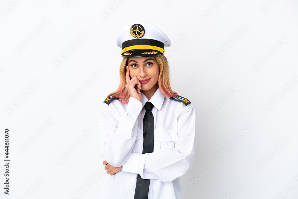 Airplane pilot over isolated white background thinking an idea Airplane pilot over isolated white background thinking an idea