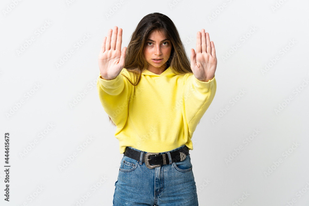 Young caucasian woman isolated on white background making stop gesture and disappointed Young caucasian woman isolated on white background making stop gesture and disappointed
