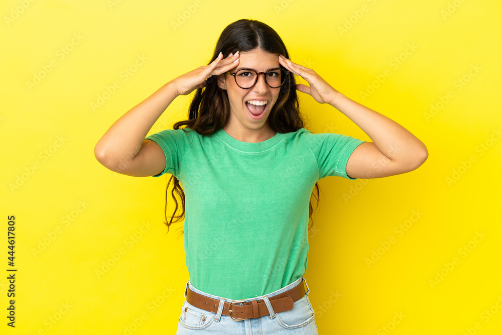 Young caucasian woman isolated on yellow background with surprise expression Young caucasian woman isolated on yellow background with surprise expression