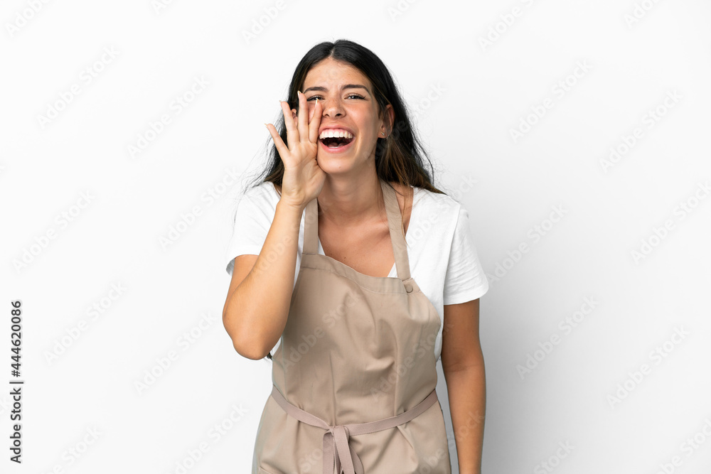 Restaurant waiter over isolated white background shouting with mouth wide open Restaurant waiter over isolated white background shouting with mouth wide open