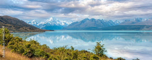 Scenic reflection of Mount Sefton and Mount Cook at lake Pukaki, New Zealand
