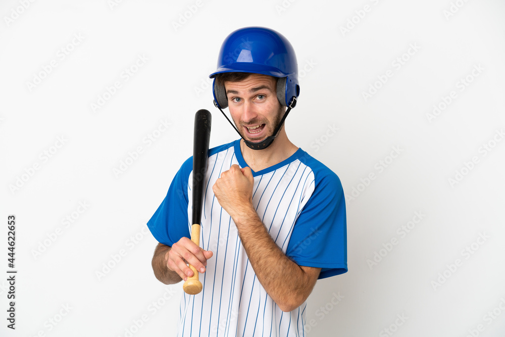 Young caucasian man playing baseball isolated on white background celebrating a victory