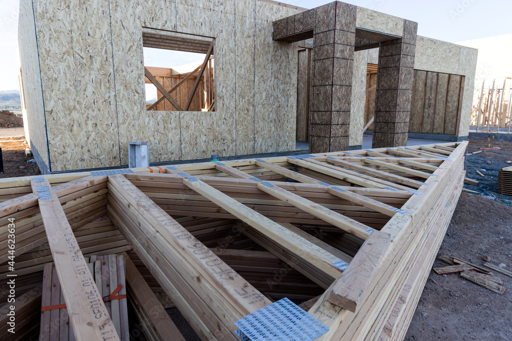 Roofing joists sit in stacks ready to be added to constuction project Roofing joists sit in stacks ready to be added to constuction project