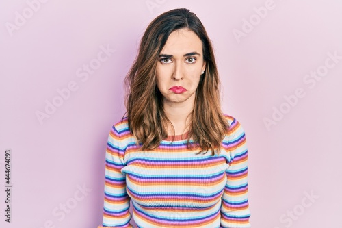 Young hispanic girl wearing casual clothes depressed and worry for distress, crying angry and afraid. sad expression.