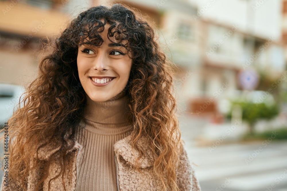 Young hispanic woman smiling happy standing at the city Young hispanic woman smiling happy standing at the city