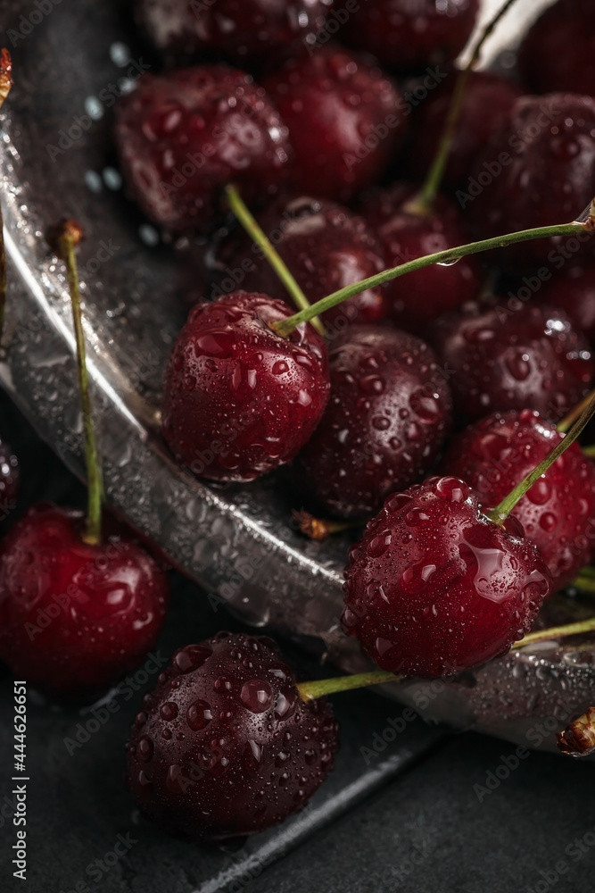 Fresh juicy cherries. Red cherry on a dark background. Macro photo. Fresh juicy cherries. Red cherry on a dark background. Macro photo.