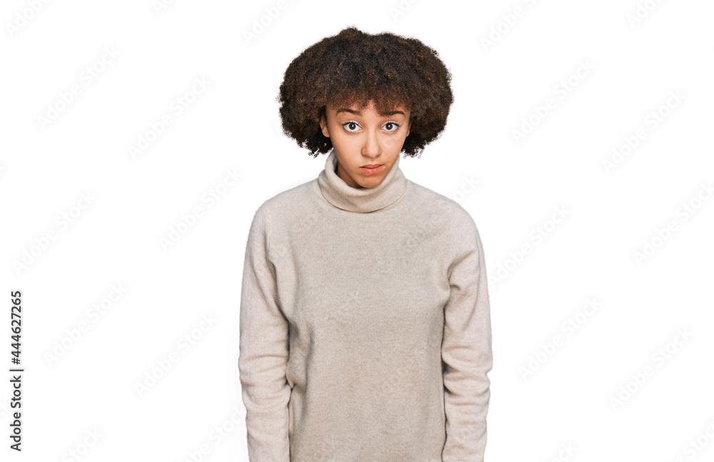 Young hispanic girl wearing wool winter sweater skeptic and nervous, frowning upset because of problem. negative person. Young hispanic girl wearing wool winter sweater skeptic and nervous, frowning upset because of problem. negative person.