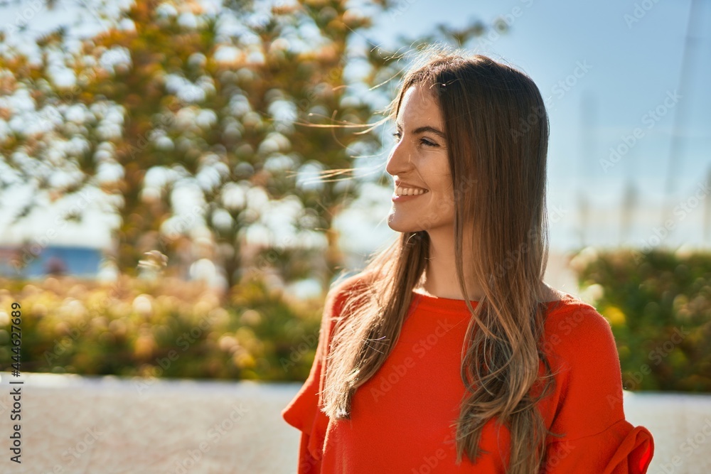 Young hispanic woman smiling happy standing at the city. Young hispanic woman smiling happy standing at the city.