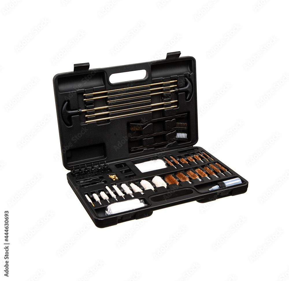 A set for cleaning weapons in a black case isolate on a white back. Weapon care tools. A set for cleaning weapons in a black case isolate on a white back. Weapon care tools.