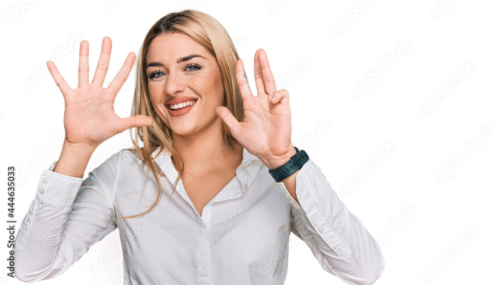 Young caucasian woman wearing casual clothes showing and pointing up with fingers number nine while smiling confident and happy. Young caucasian woman wearing casual clothes showing and pointing up with fingers number nine while smiling confident and happy.