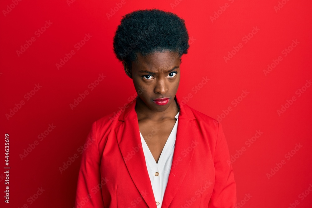 Obraz premium Young african american girl wearing business clothes skeptic and nervous, frowning upset because of problem. negative person.