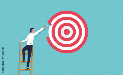 Businessman painting a big target with paint roller. Ambitious and determination concept vector illustration.