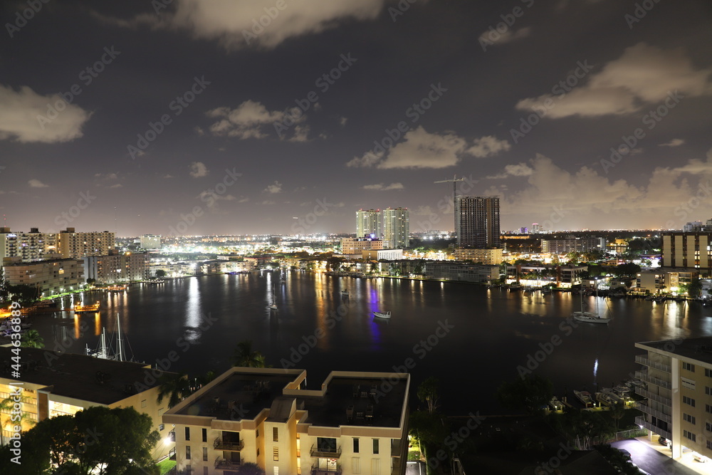 Fototapeta premium Golden Isles Lake, Hallandale Beach, Florida, USA. Night view for residential skyscrapers. 