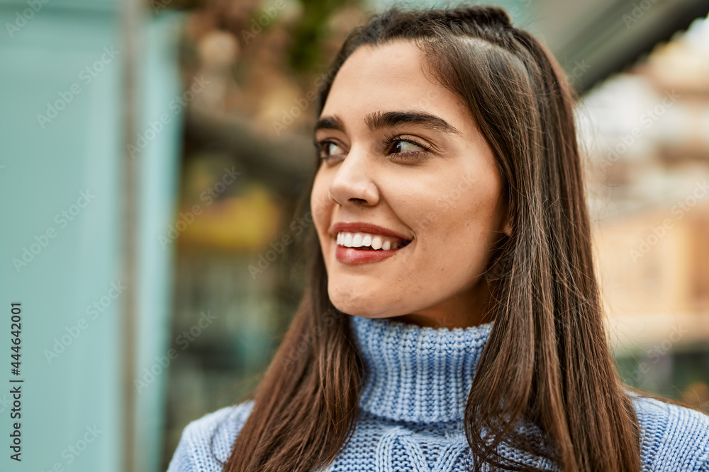 Young hispanic girl smiling happy standing at the city Young hispanic girl smiling happy standing at the city