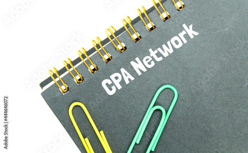 notebook, click paper and word cpa network. Business concept photo