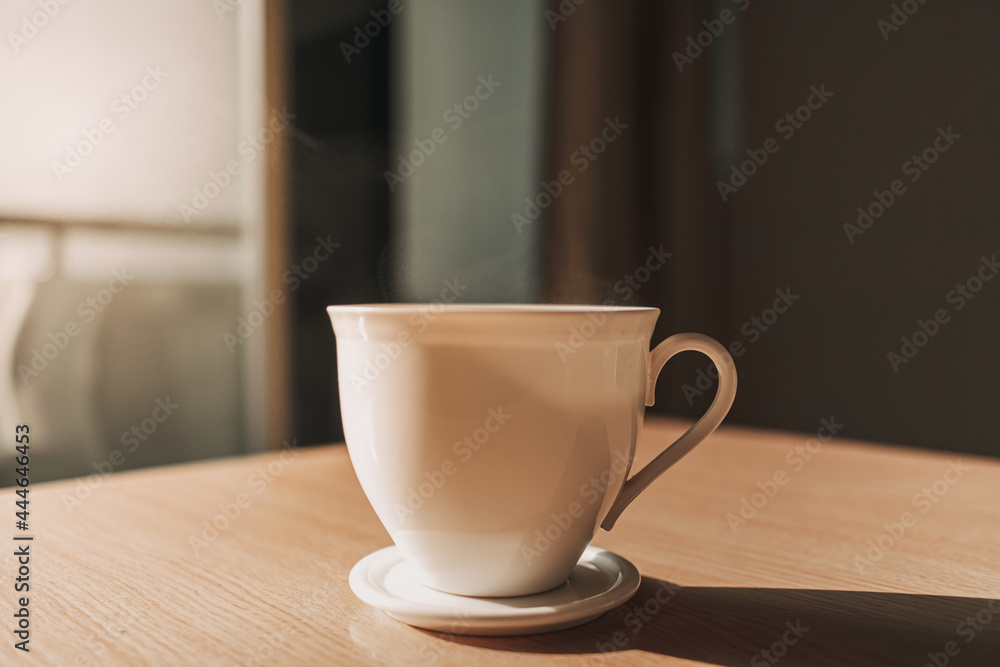 Hot cup of drink on the table in sun light of calm and warm morning. Hot cup of drink on the table in sun light of calm and warm morning.