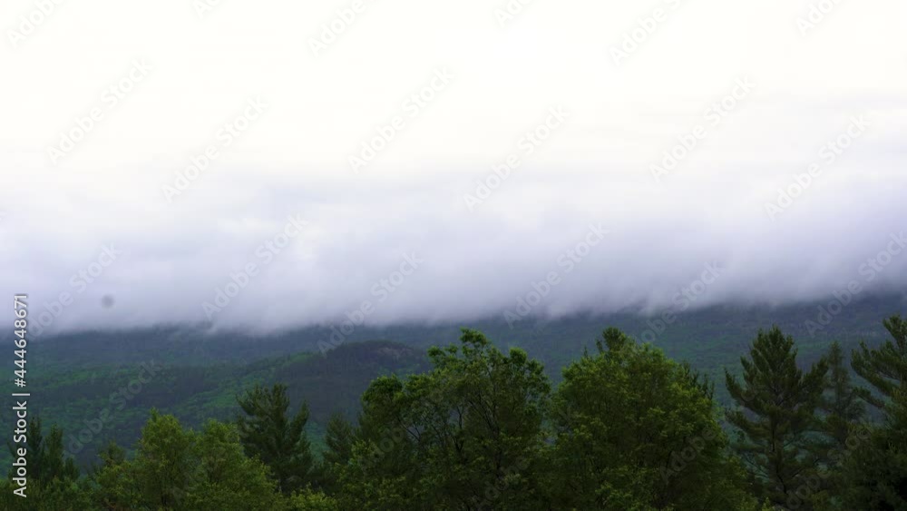Cloud and haze fog rolling over mountains with lush forest (4k 30p) Cloud and haze fog rolling over mountains with lush forest (4k 30p)