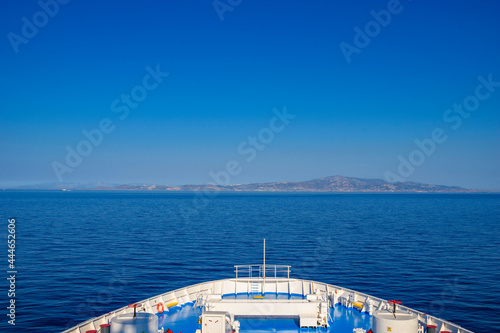 Parikia, Greece - June 2017: Port and the town Parikia as seen from the deck of a Blue Star Ferry boat approaching the island. Paros, Cyclades, Greece, Europe