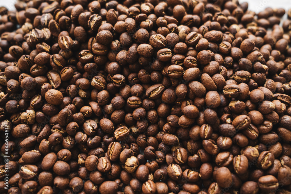 Premium Roasted coffee beans on background Premium Roasted coffee beans on background