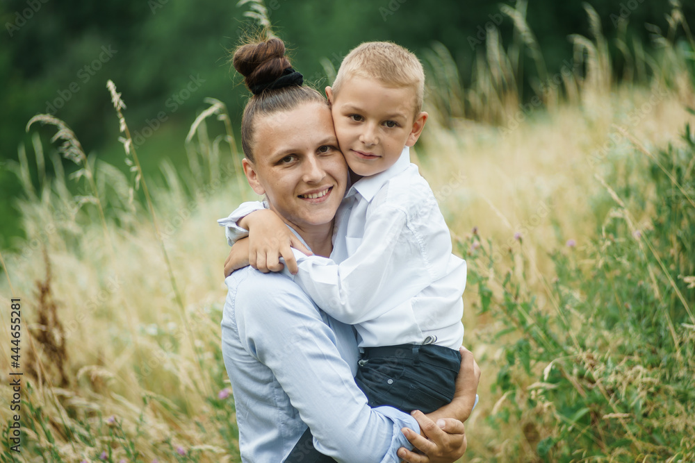 the mother holds a smiling child in her arms the mother holds a smiling child in her arms