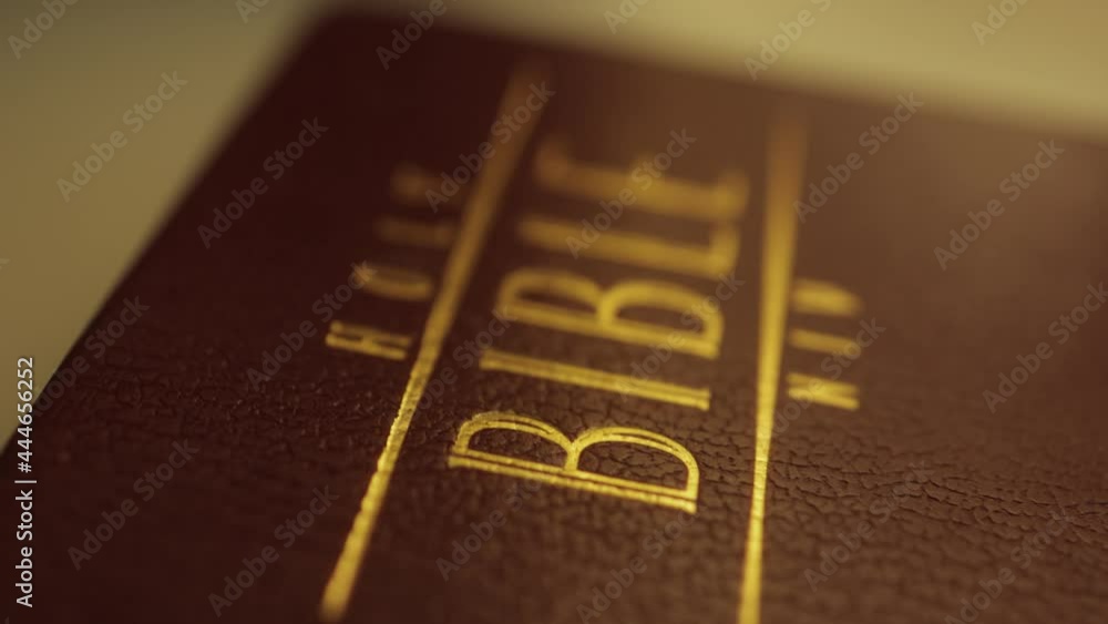 close up of holy bible book on shelf close up of holy bible book on shelf