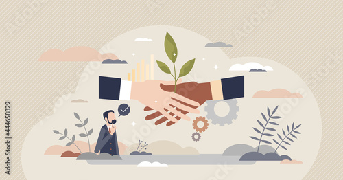 Sustainable partner and environmental friendly business tiny person concept. Corporate deal or agreement symbolic handshake with green leaf vector illustration. Climate awareness in company strategy.