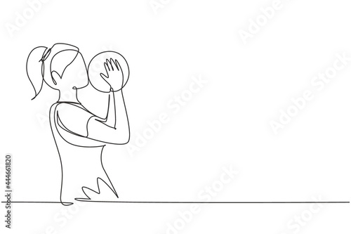 Single continuous line drawing female football player kissing ball with pride. Happy expression in national level competition. Professional player. One line draw graphic design vector illustration