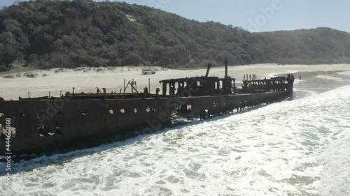 Drone slowly orbiting the abandoned SS Maheno shipwreck, washed up on the coastline of Fraser Island in Australia. photo
