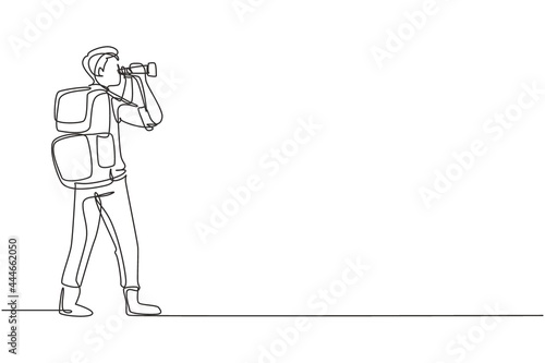 Continuous one line drawing male adventurer carrying backpack while looking through binoculars. Exploration of mountainous or hilly landscapes. Single line draw design vector graphic illustration