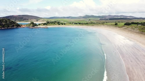 Aerial drone of the stunning curved beach of Maitai Bay, Karikari Peninsula, Northland, New Zealand Aotearoa photo