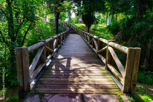 Wooden bridge over a small stream in the Retiro public park  Madrid.