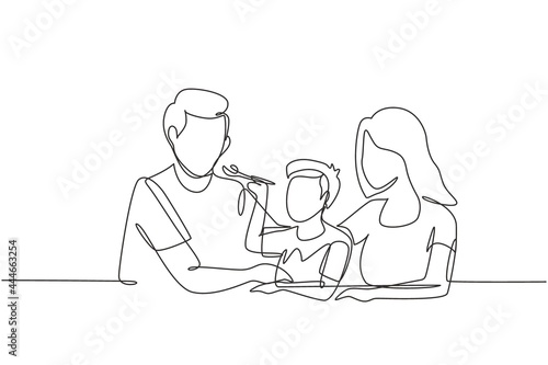 Continuous one line drawing young family having fun together in modern restaurant. Boy feeds his father with love. Happy little family concept. Single line draw design vector graphic illustration