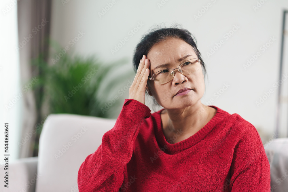 Exhausted tired depressed stressed thoughtful mature senior woman suffering from headaches, Brain diseases, mental problems, Alzheimer Concept.. Exhausted tired depressed stressed thoughtful mature senior woman suffering from headaches, Brain diseases, mental problems, Alzheimer Concept..